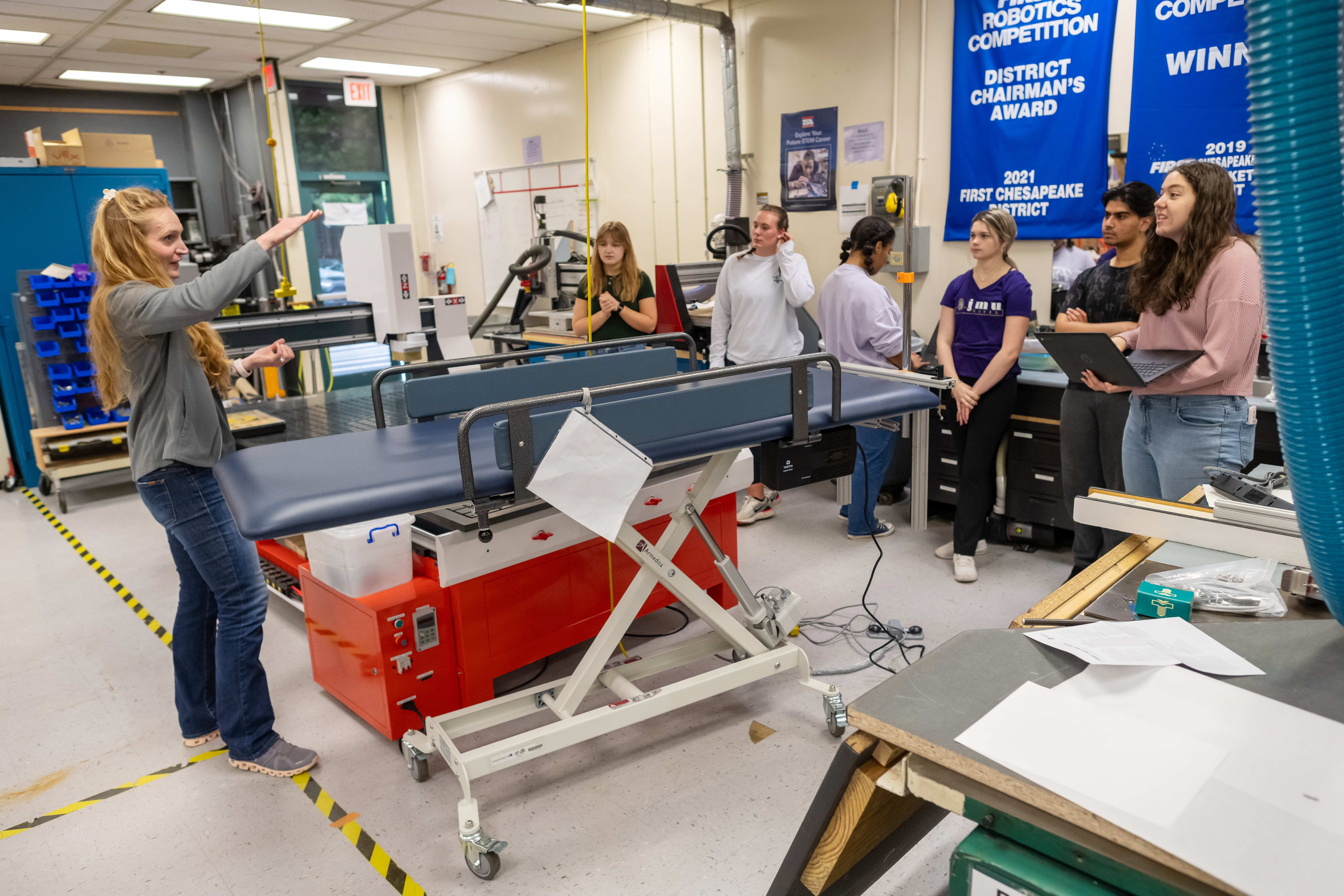 PT/OT teacher Lindsey Grilliot instructs her students inside the Engineering classroom.