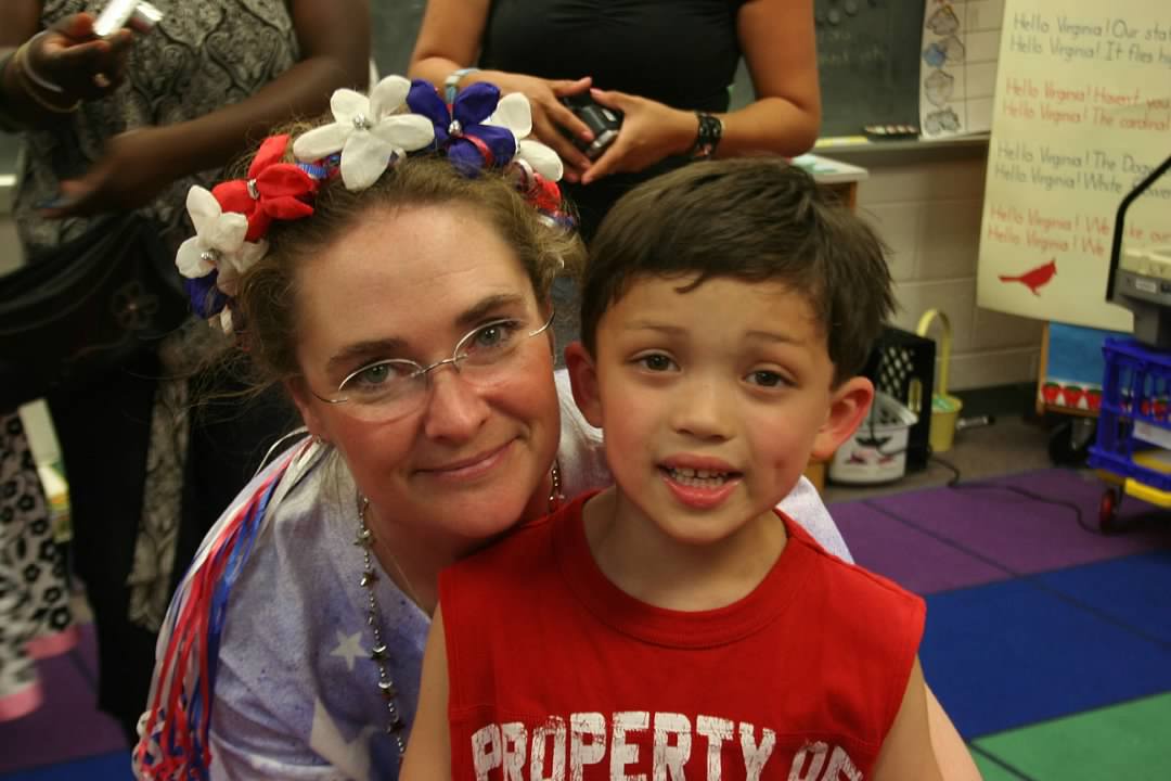Logan pictured with a kindergarten teacher in his early days with FCPS