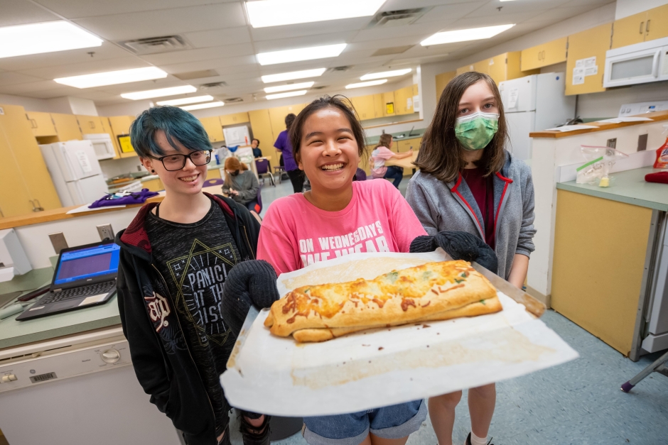 students showing their culinary project