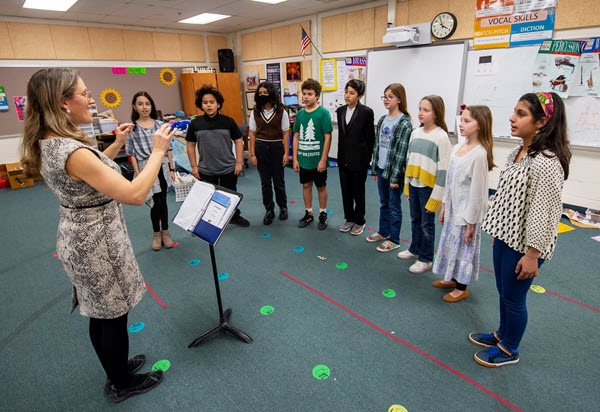 music teacher with singers