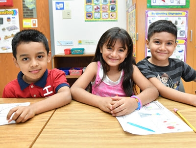 three elementary school students