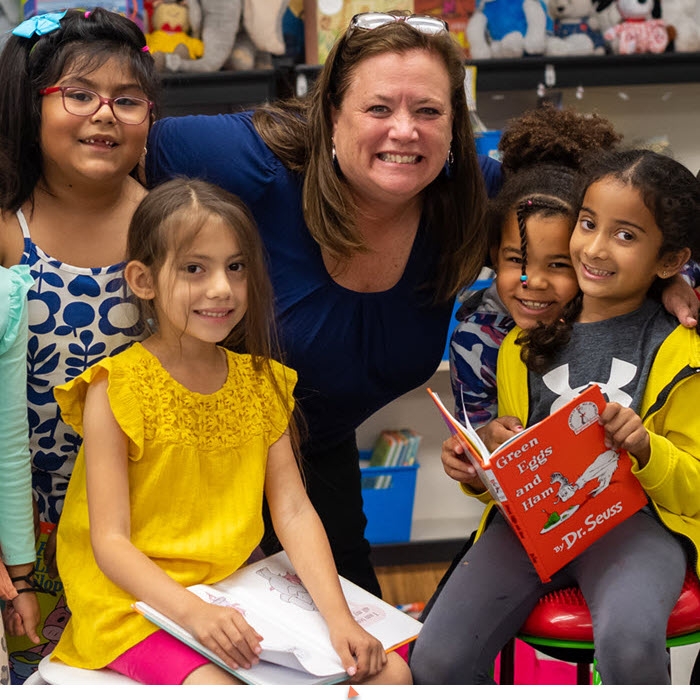 teacher with young students