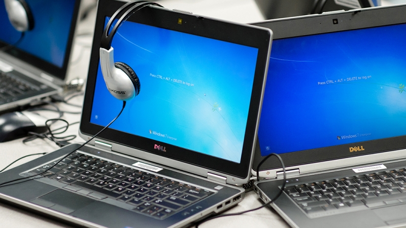 two laptops and a pair of headphones