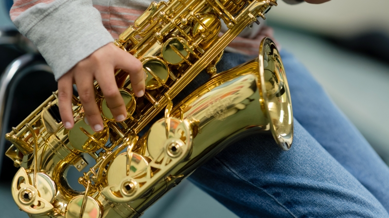 Student playing a saxophone