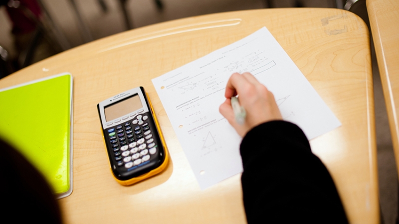 Desk with calculator and paper