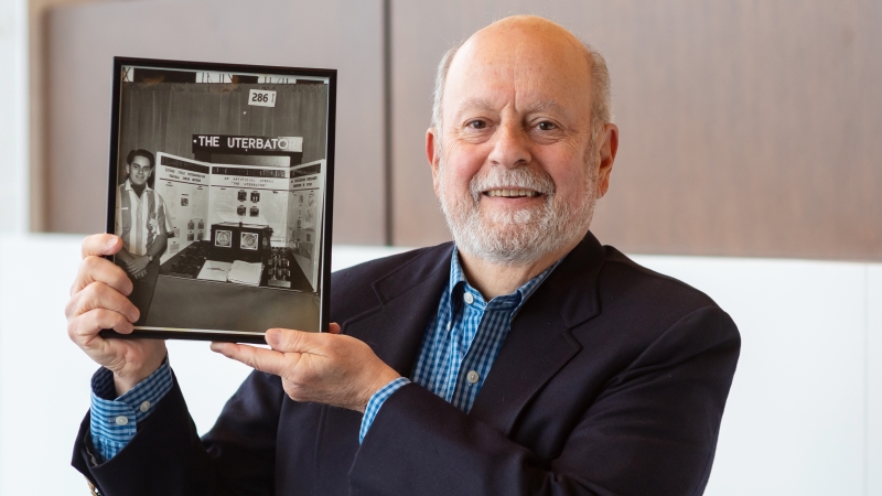 Dr. Chet Kessler displaying his science fair project from 1963