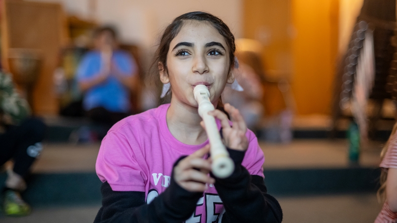 A student at Virginia Run Elementary School practices playing the recorder.