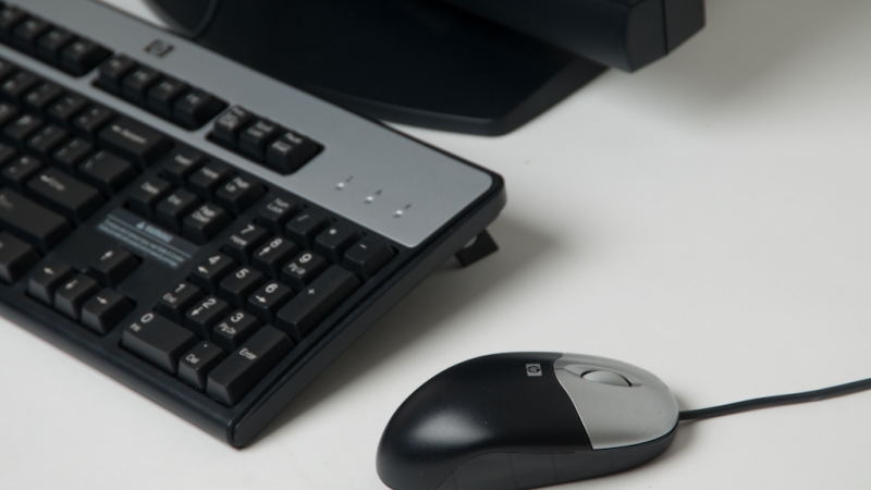 photo of a computer keyboard and mouse