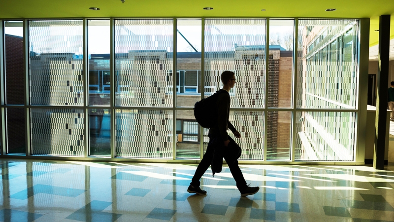 student walking in a hallway