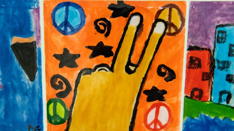 Student artwork of peace signs