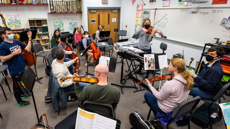 The Parent Orchestra practices at Annandale High School. 