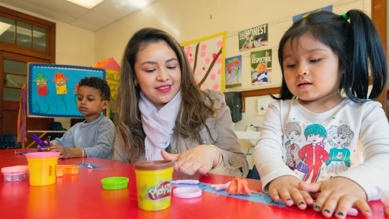 students play with playdoh