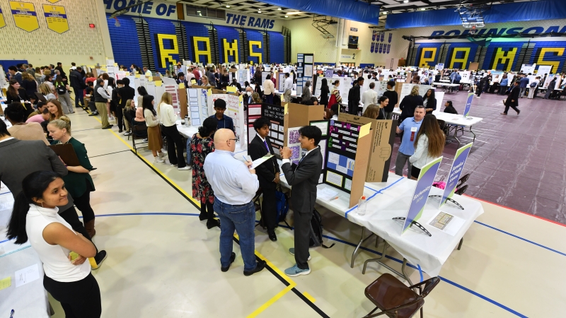 students presenting their work at the Science fair