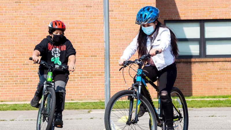 Students riding bicycles.