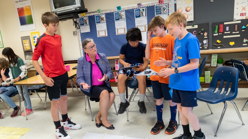 Picture of Dr. Reid with Fairfax County Public School Students