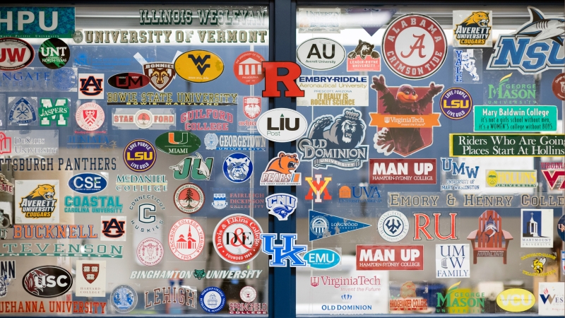 college and university stickers on a window