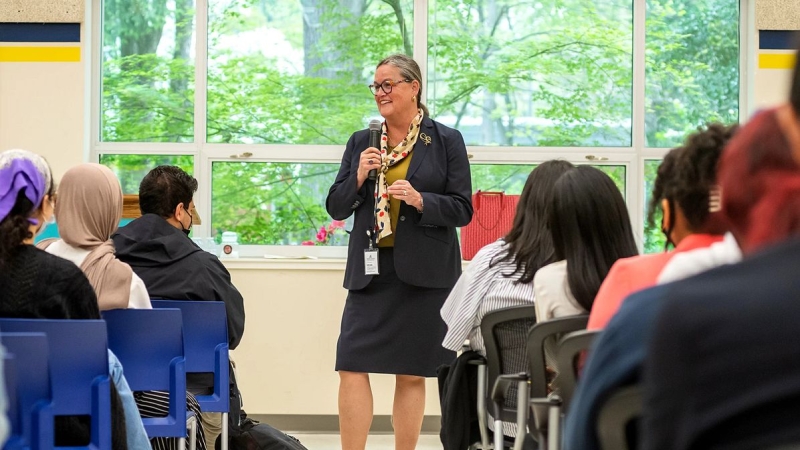 Dr. Reid speaking with students