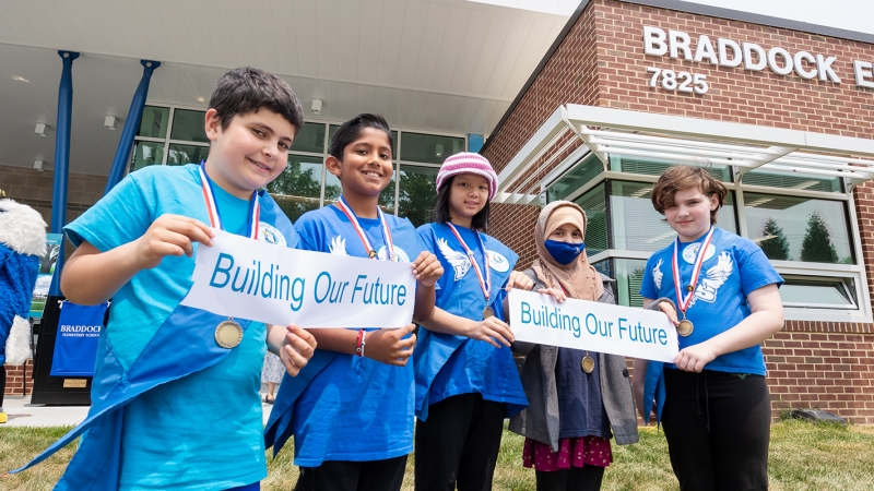 Students celebrate a ribbon cutting