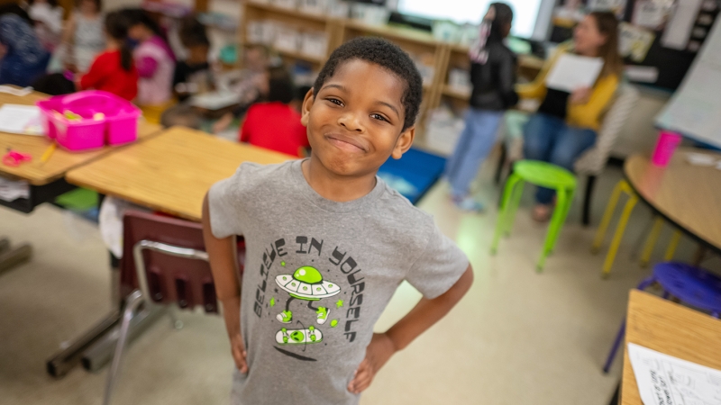 a smiling first grader