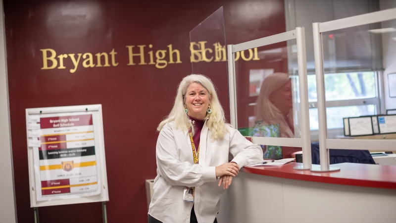 Karen Hertel stands in the Bryant school office