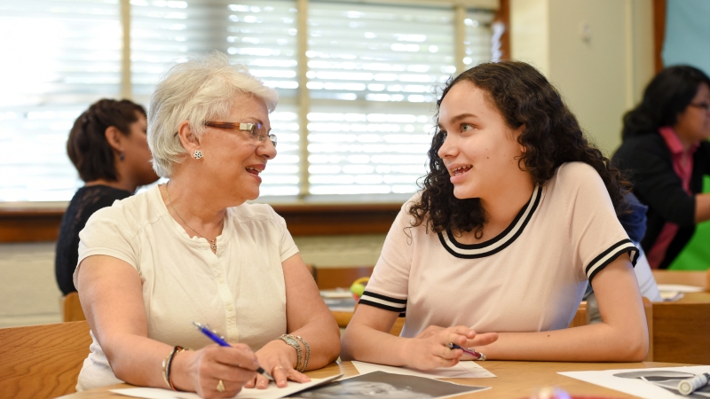 an adult interacting with a student