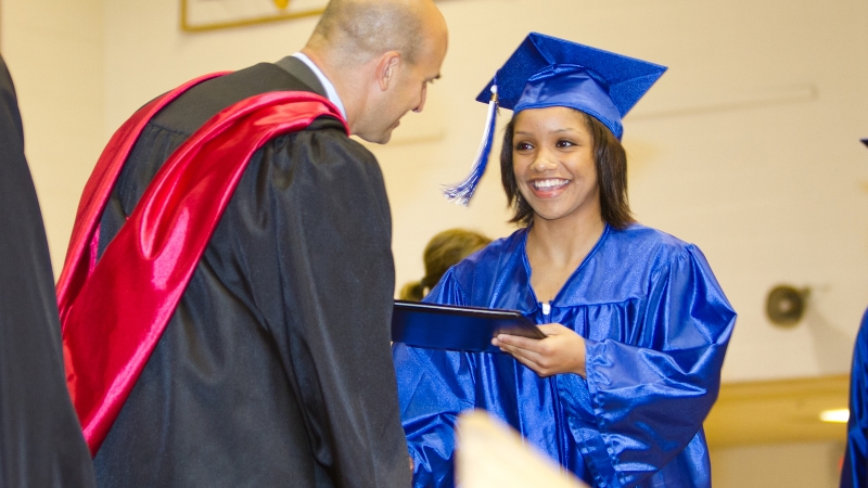 photo of a girl receiving her diploma