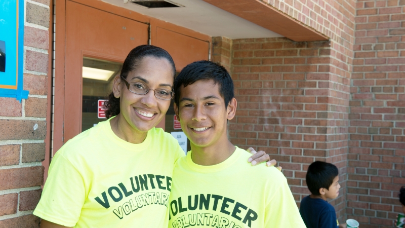 Two People wearing volunteer shirts