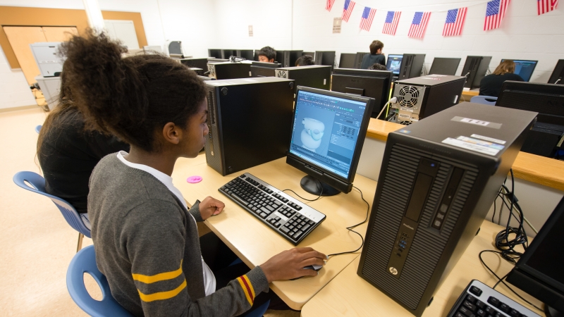 student sitting at a computer