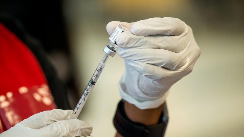 Needle being prepared for a vaccination. 