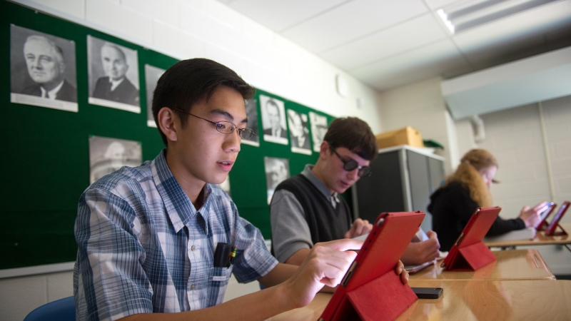 image of students on tablets