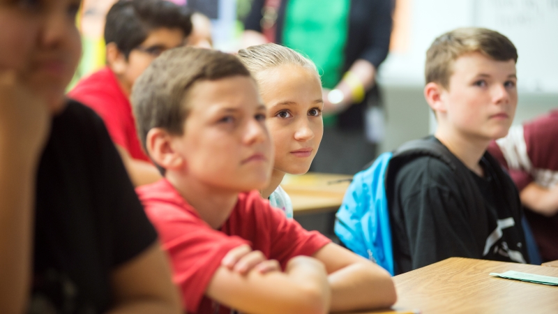 students close-up sitting in a classroom