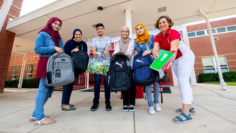 high school students donating school supplies