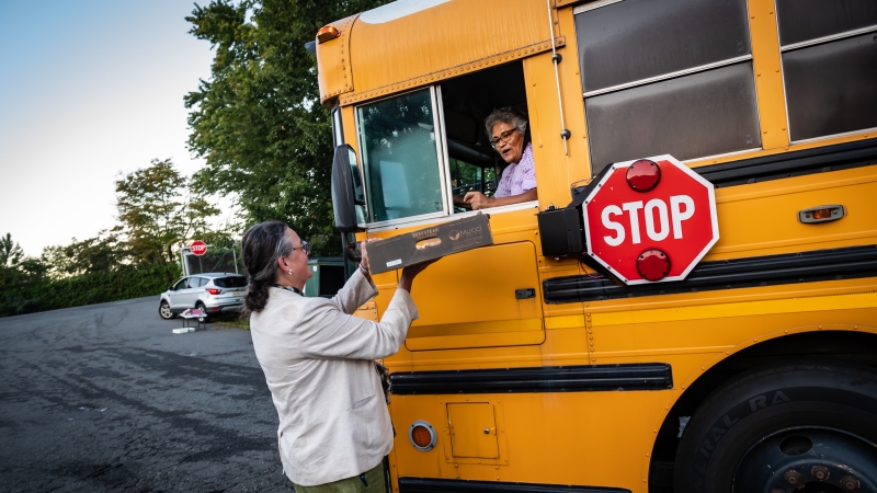 Dr. Reid greets a bus driver. 