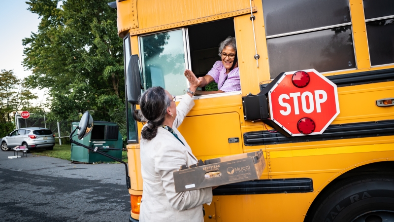 Dr. Reid Serving Donuts to Bus Drivers