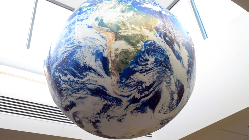 model of earth hanging from school ceiling