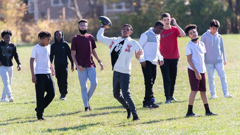 Children playing on the field during recess