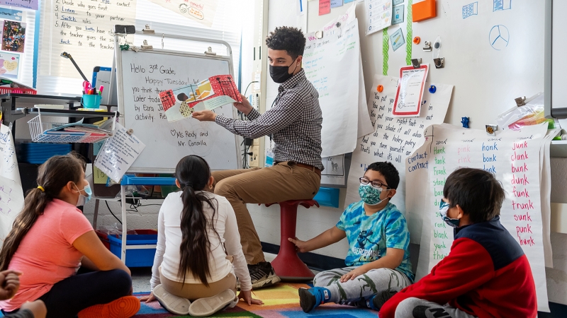 Julian Consolla reads to a class at Mount Eagle Elementary. 