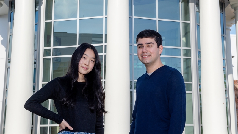 Jessica Ye and Liam Reaser stand outside TJHSST. 