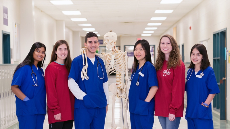 students in the medical sciences class standing in a hallway