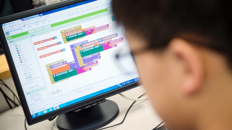 a student working on computer coding 