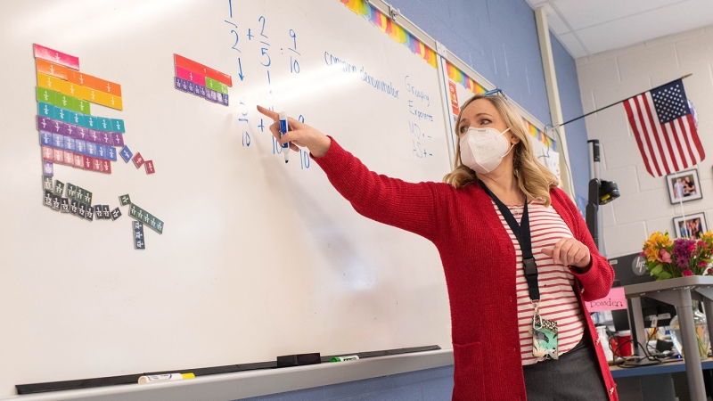 Rocky Run Middle School math teacher Laura Roberston used magnetic fraction tiles to teach students how to find the common denominator when adding fractions.