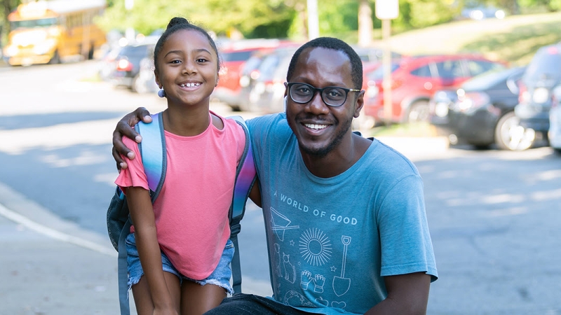 father and daughter on way to school