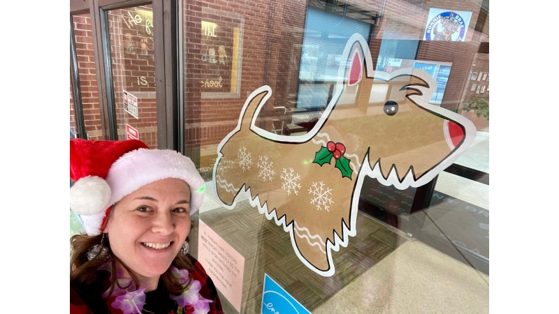 Lora Lewis and her gingerbread Scottie dog she painted. 