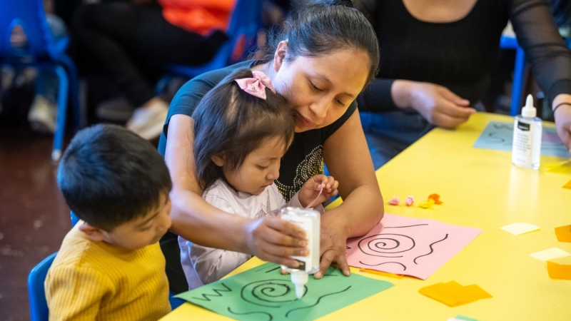 Mother and Children working with glue