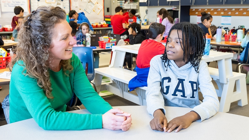 Hayfield Elementary teacher Nicole Johnson chats with a student.