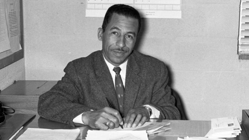 Black and white photograph of Principal Taylor M. Williams at Luther Jackson High School in 1958.