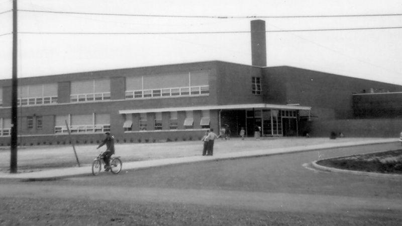 Black and white photograph of the exterior of Hollin Hall Elementary School taken in 1954.