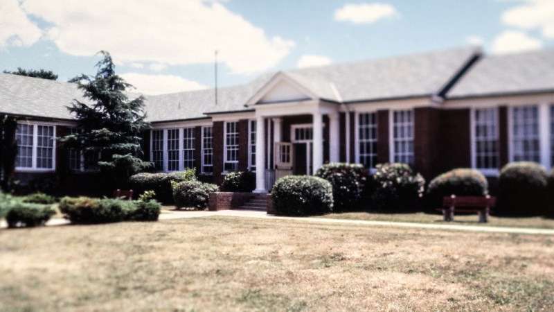 Color photograph of the front exterior of Lorton Elementary School taken in the mid-1980s.