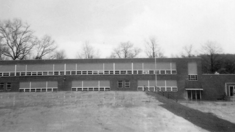 Photograph of the front exterior of Willston Elementary School taken in 1954.