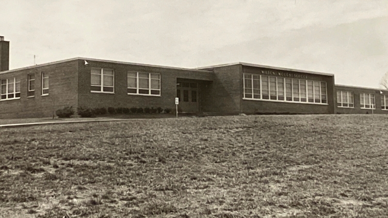 Photograph of the front exterior of Wilton Woods Elementary School that was taken in the mid-1960s.